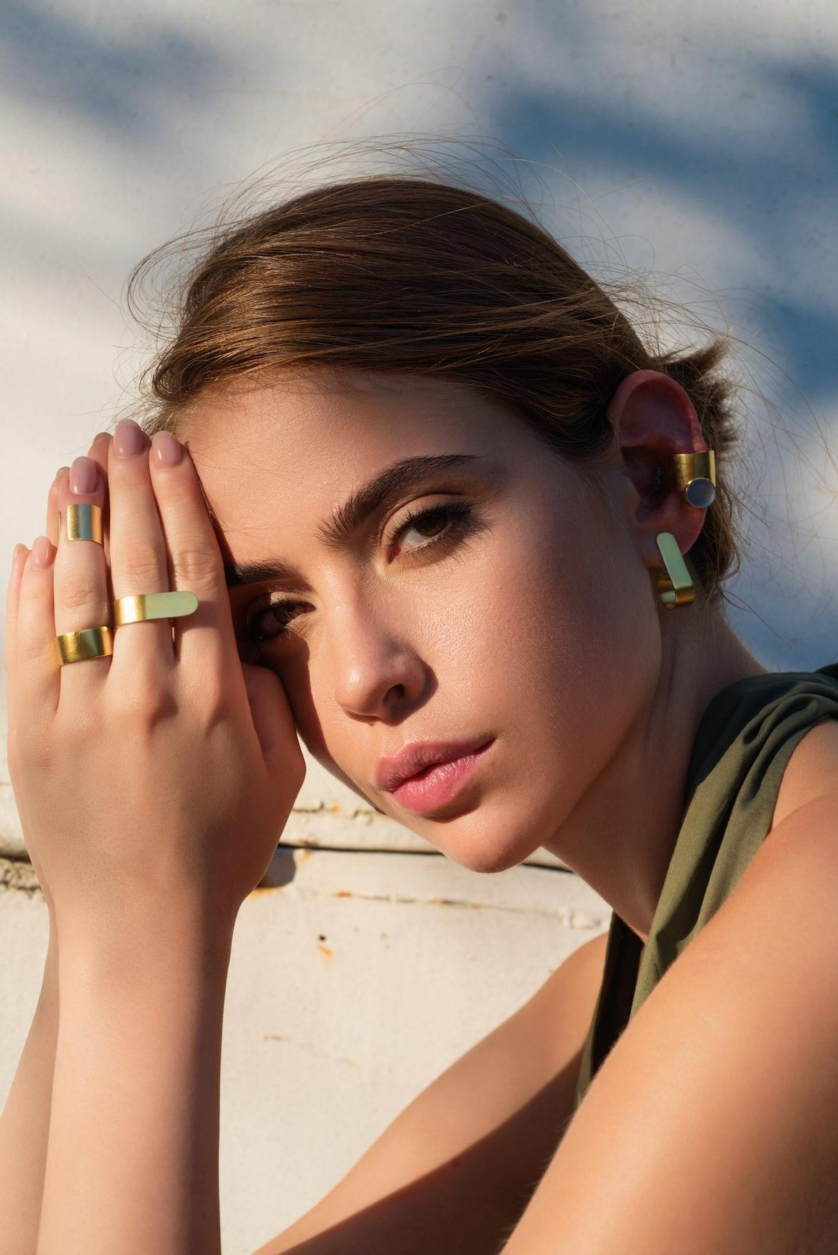 Woman wearing sculptural gold rings