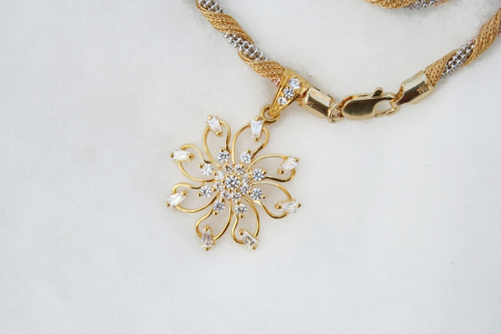 Floral diamond pendant on a gold chain